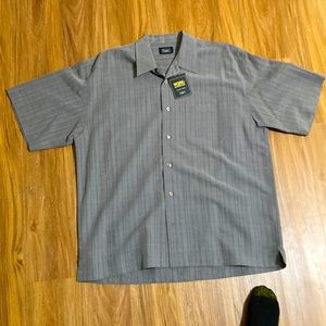 A Haggar button down large gray shirt.